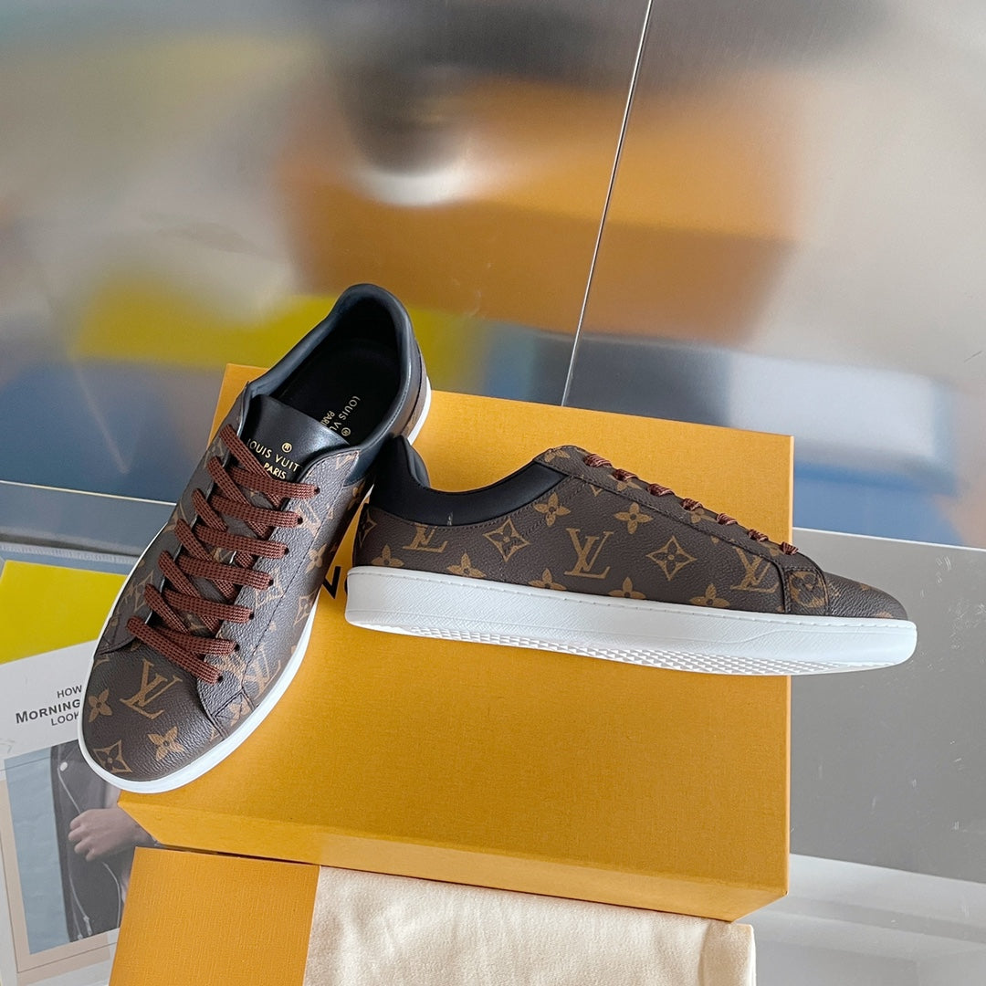 Louis Vuitton unisex sneakers, monogram canvas upper and white rubber sole.
