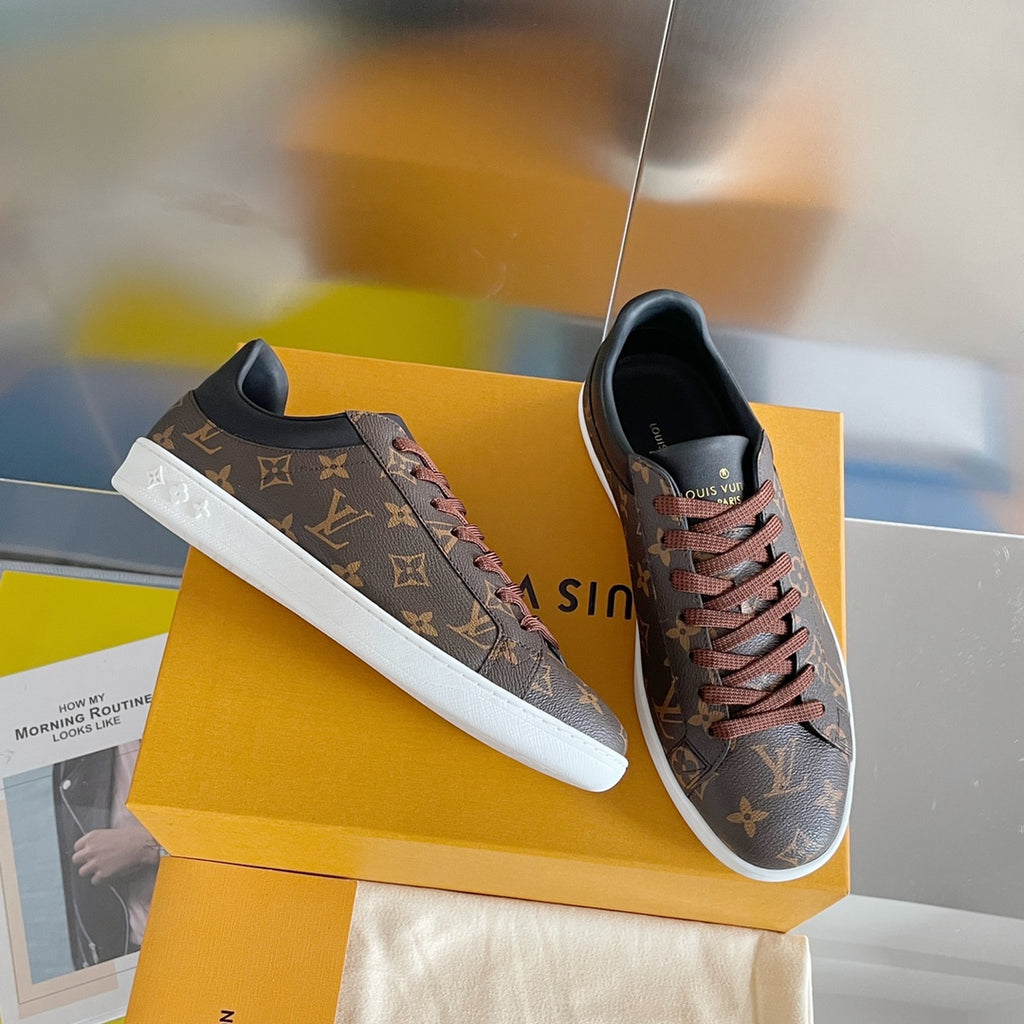 Louis Vuitton unisex sneakers with monogram canvas, lace-up, white rubber sole.
