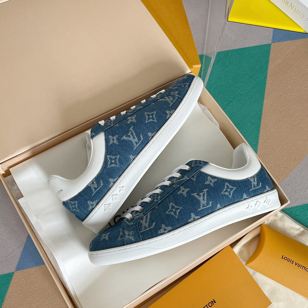 Louis Vuitton blue denim sneakers with white laces and monogram print, top view