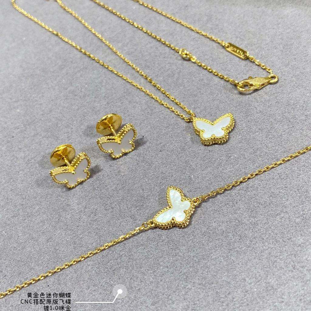 Gold butterfly jewelry set: necklace chain and matching stud earrings