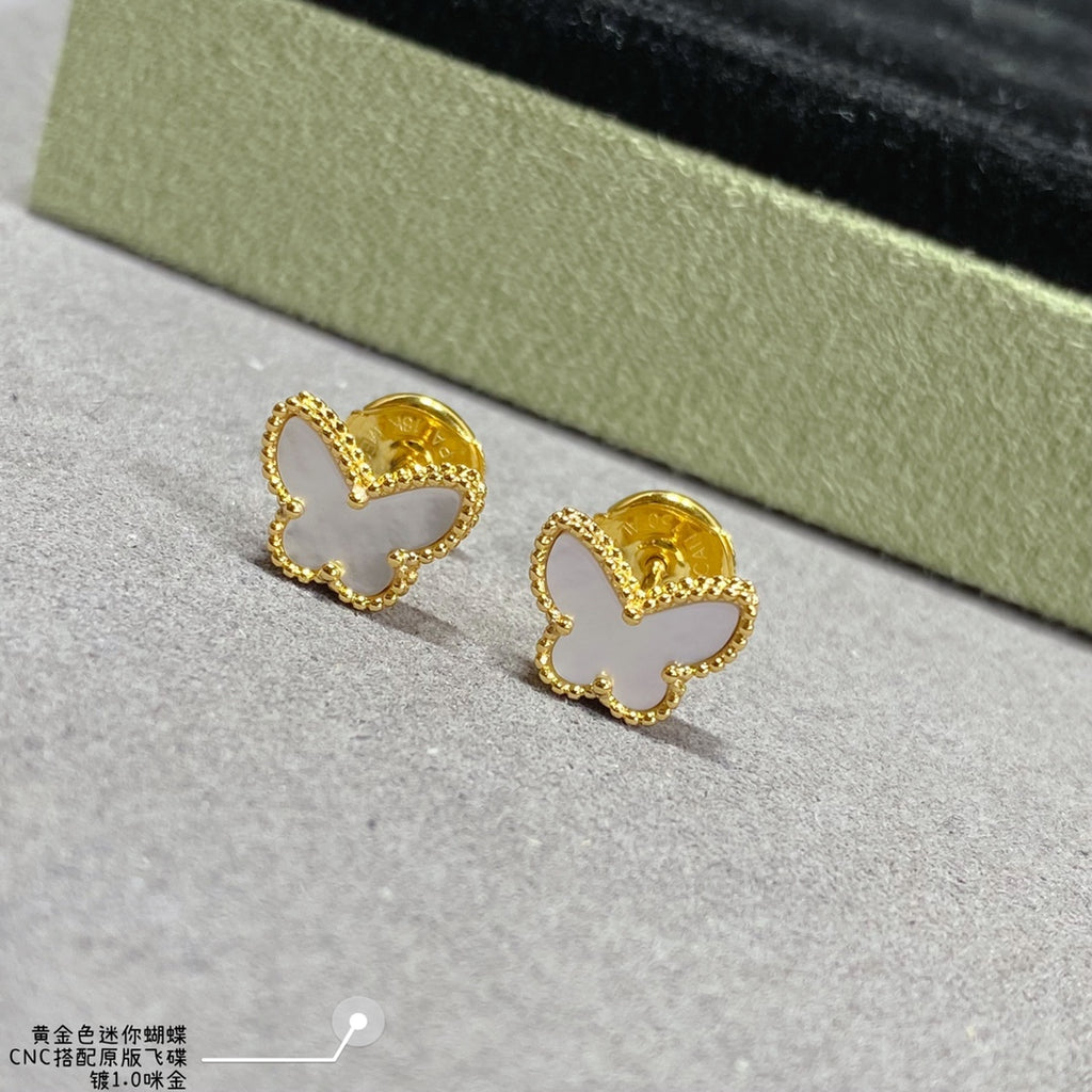Gold butterfly hoop earrings with scalloped edges and small inner cutout