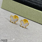 Gold butterfly hoop earrings with scalloped edges and small inner cutout