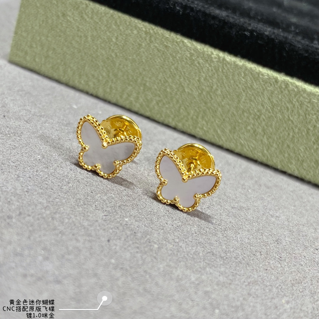 Gold butterfly hoop earrings with scalloped edges and small inner cutout