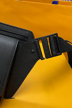 Louis Vuitton bag corner close-up with zipper track and dark leather strap tab