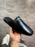 Black leather slide sandals with BALENCIAGA logo on the strap