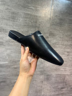 Black leather mule sandal with open back and BALENCIAGA logo strap