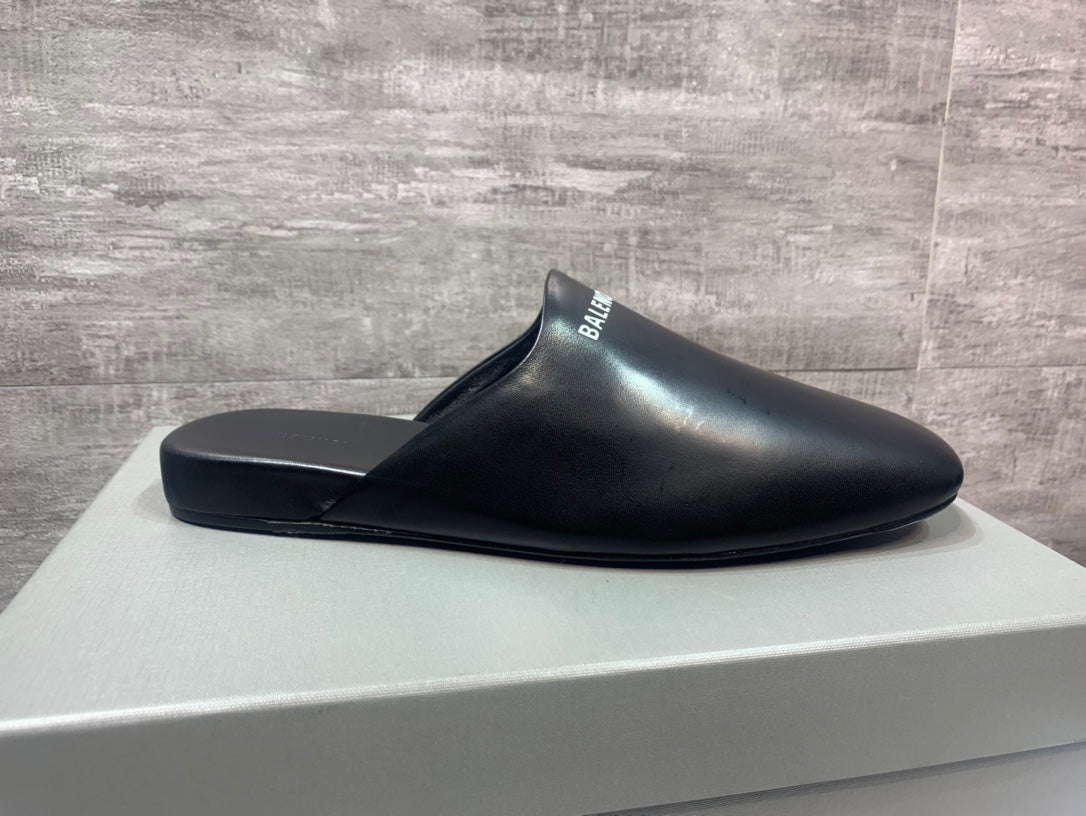 Black slide sandals with wide toe cover and BALENCIAGA logo strap