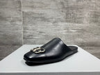 Single black leather slide sandal with silver-tone double-ring buckle hardware