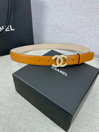 Tan leather belt with rhinestone CC buckle and visible strap lining and stitching