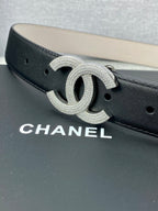 Black leather belt with silver-tone CC logo buckle, detailed glitter finish