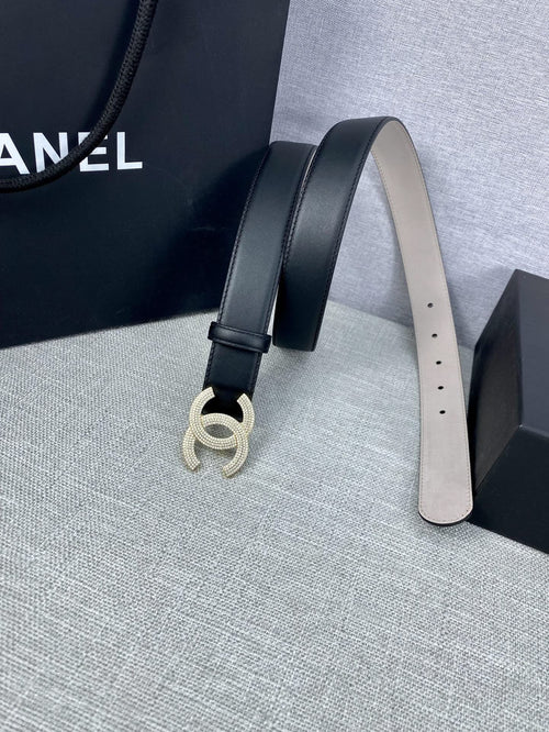 Black leather belt with silver-tone CC buckle and punched sizing holes