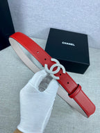 Red leather Chanel belt with silver-tone Double C buckle and punched holes