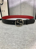 Gucci belt in black leather with embossed pattern, silver-tone GG buckle, red underside