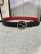 Gucci belt in black leather with embossed pattern, silver-tone GG buckle, red underside