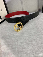 Gucci belt in black embossed leather with gold-tone GG buckle and red underside