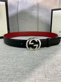 Gucci black leather belt with textured pattern and silver double-G buckle