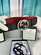 Gucci black leather belt with embossed pattern and silver double-G buckle