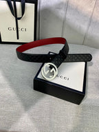 Gucci black leather belt with embossed pattern and silver double-G buckle