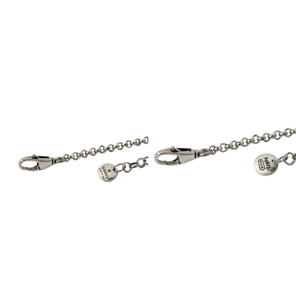 Gucci silver charm bracelet with oval clasp and logo tag