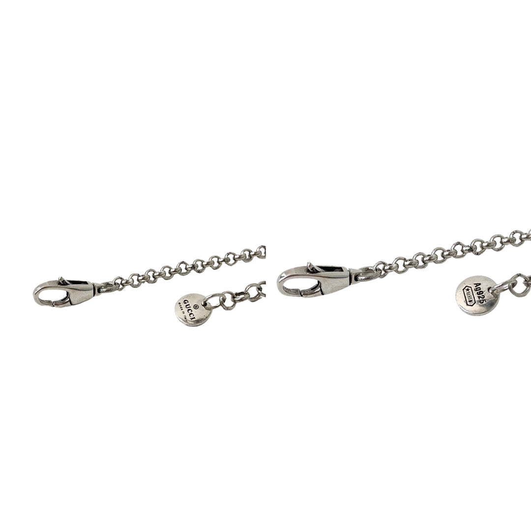Gucci silver charm bracelet with oval clasp and logo tag