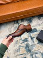Prada unisex oxford shoe side view, brown leather lace-up with brogue detailing
