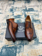 Prada unisex oxford shoes, brown leather lace-ups with brogue-style perforations