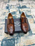 Prada unisex oxford shoes, brown leather lace-up with wingtip perforations