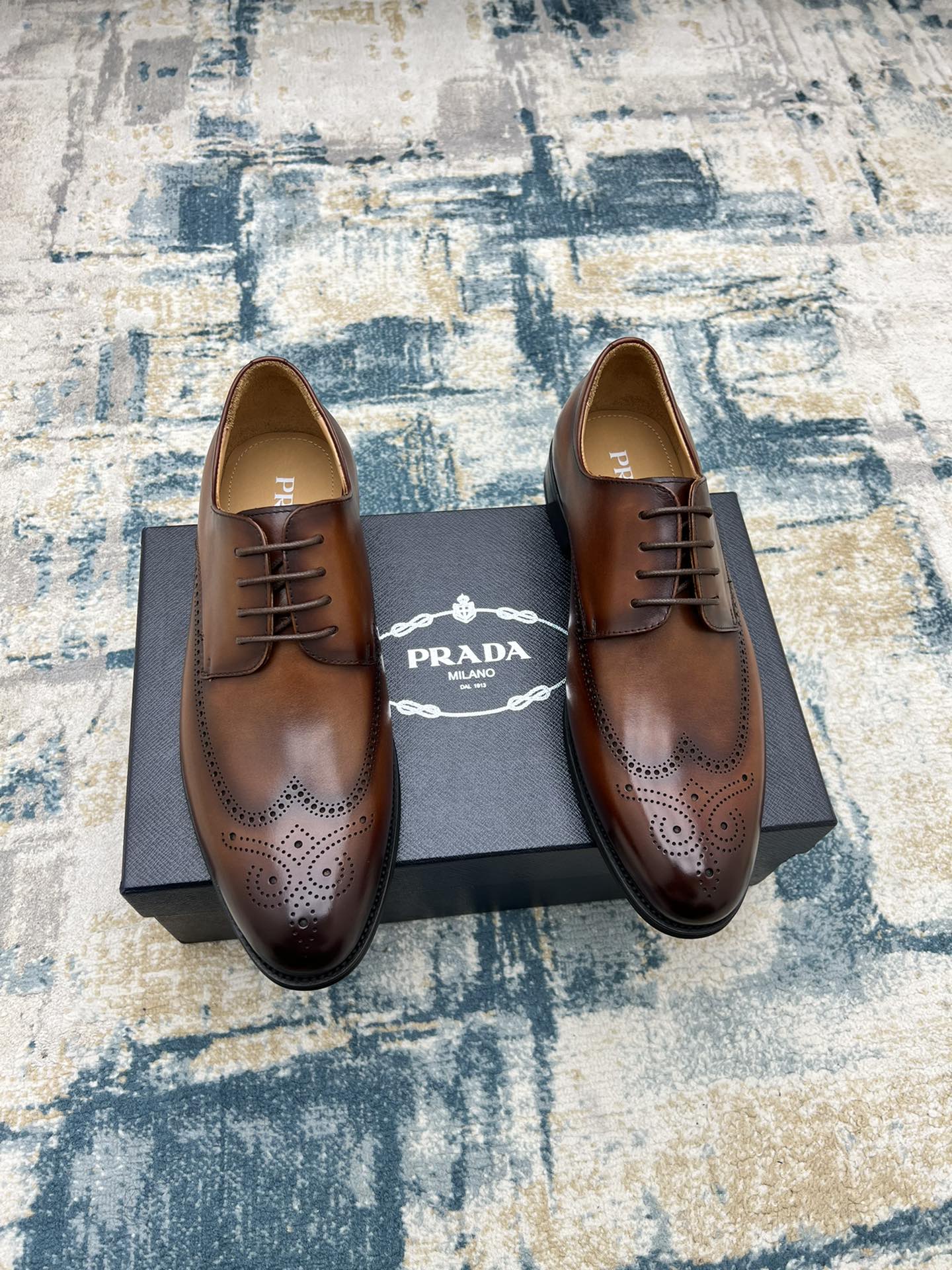 Prada unisex oxford shoes, brown leather lace-up with wingtip perforations