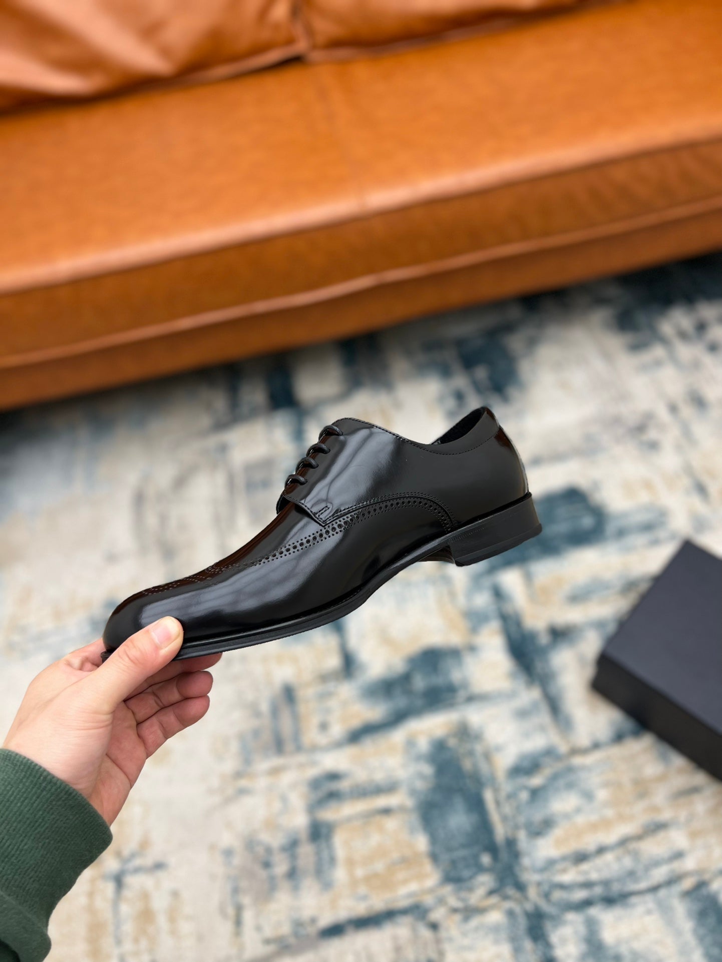 Black leather lace-up derby shoe with sleek upper and low sole