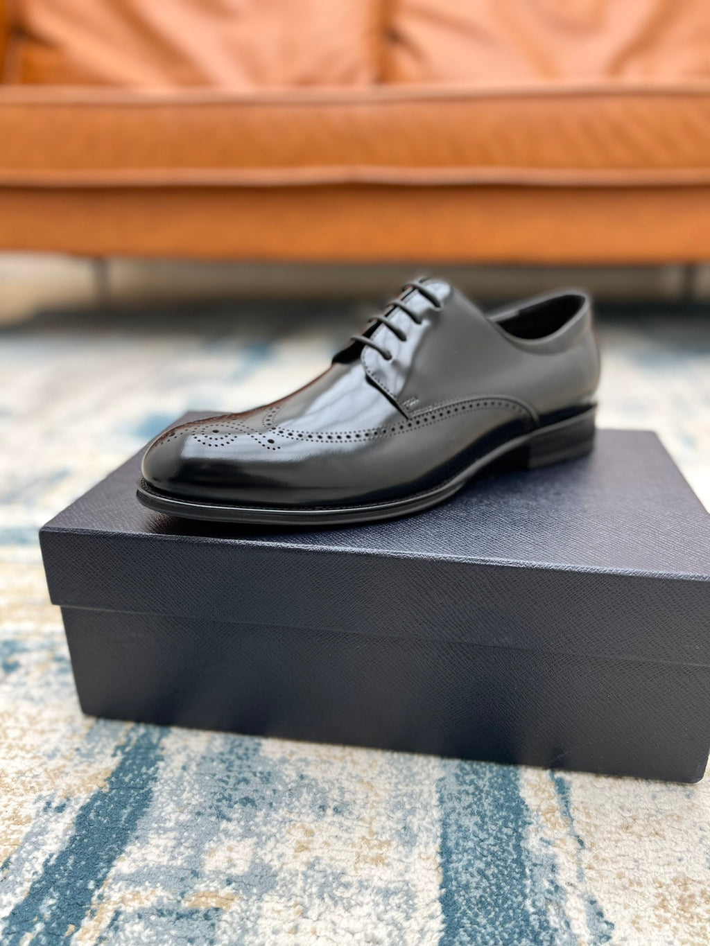 Black leather lace-up derby shoe on box, rounded toe