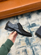 Black leather lace-up derby shoe with low profile sole
