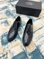 Prada lace-up leather derby shoes in dark leather with perforated toe panels