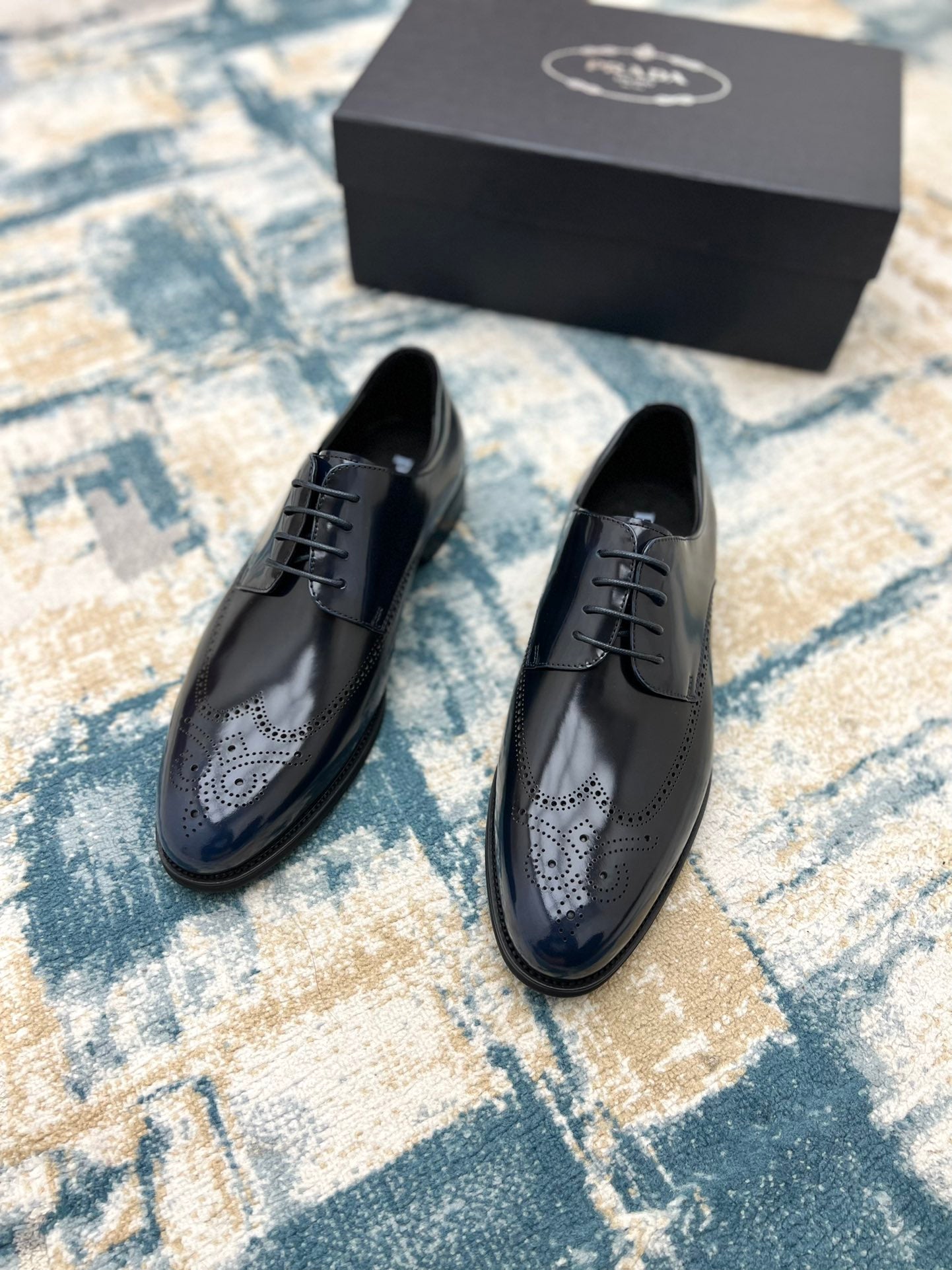 Prada unisex dark leather lace-up shoes pair with perforated toe and black laces