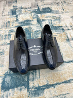 Prada unisex dark leather lace-up shoes with wingtip detailing and perforated toe