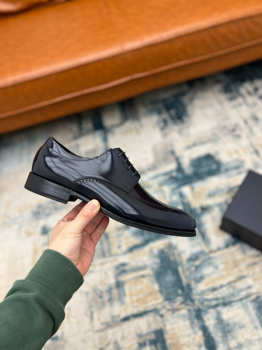 Prada lace-up leather derby shoe in dark leather with perforated panels and laces