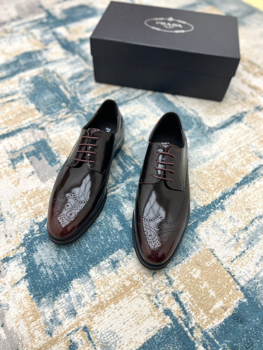Prada unisex two-tone leather lace-up shoes, front view, on pair arrangement