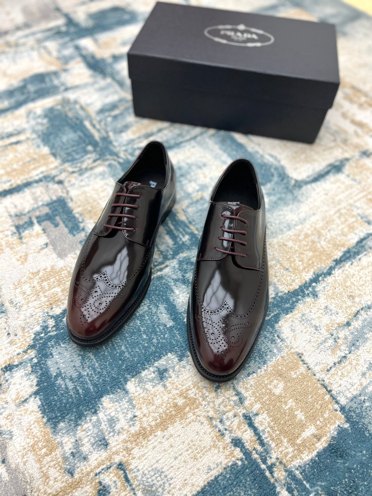 Prada unisex two-tone leather lace-up shoes, front view, on pair arrangement