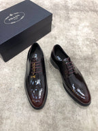 Prada lace-up dress shoes in dark brown glossy leather, side view pair