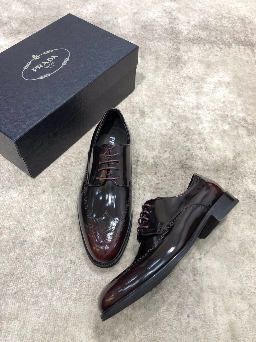 Prada lace-up dress shoes in dark brown glossy leather, pair with side profile