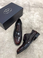Prada lace-up dress shoes in dark brown glossy leather, pair with side profile