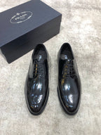 Prada unisex lace-up dress shoes in dark leather, glossy finish, with box