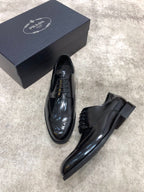 Prada lace-up dress shoes with dark leather upper and thick sole, pair with box