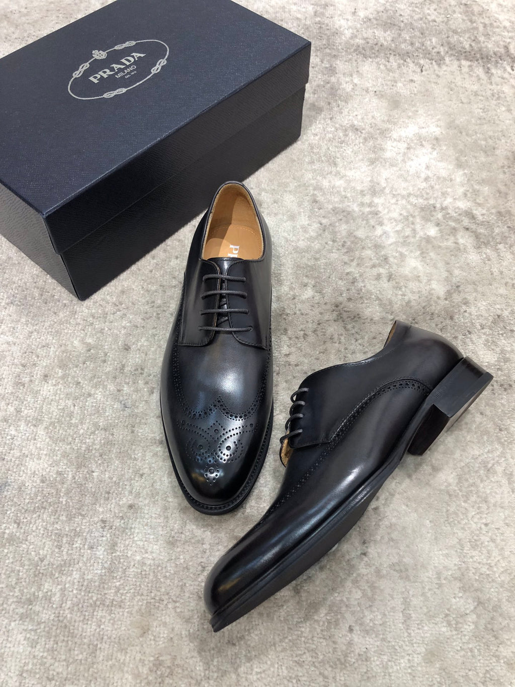 Prada unisex black leather lace-up dress shoes with brogue toe detailing