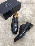Prada unisex black leather lace-up dress shoes with brogue toe detailing