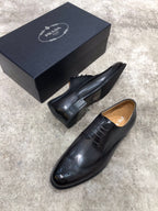 Prada unisex black leather lace-up oxford shoes with perforated detailing