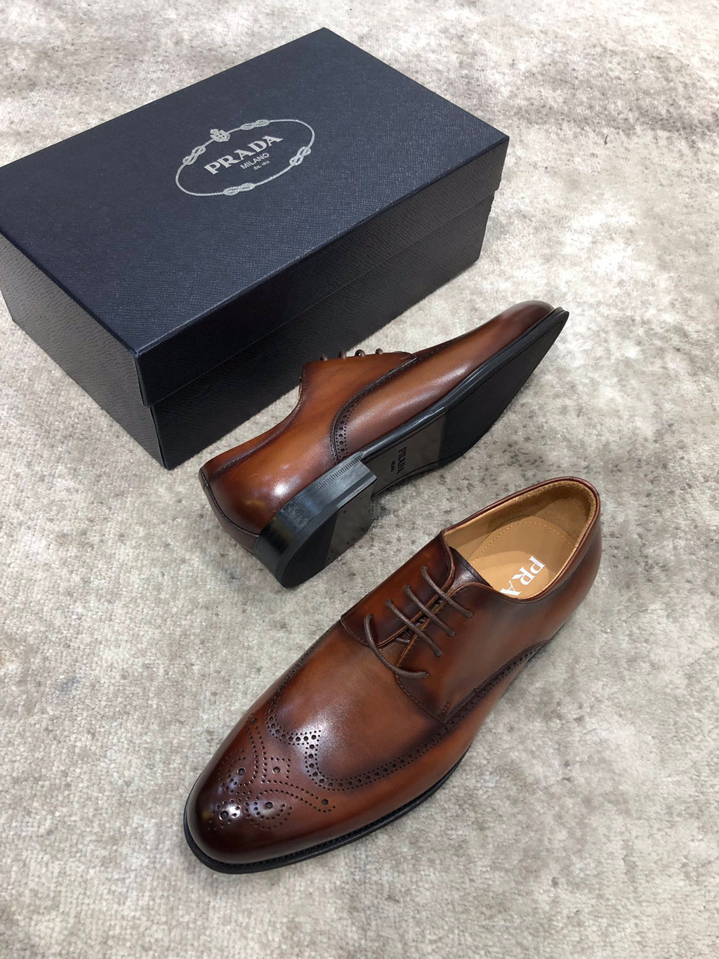 Prada brown leather lace-up brogue shoes with black sole underside