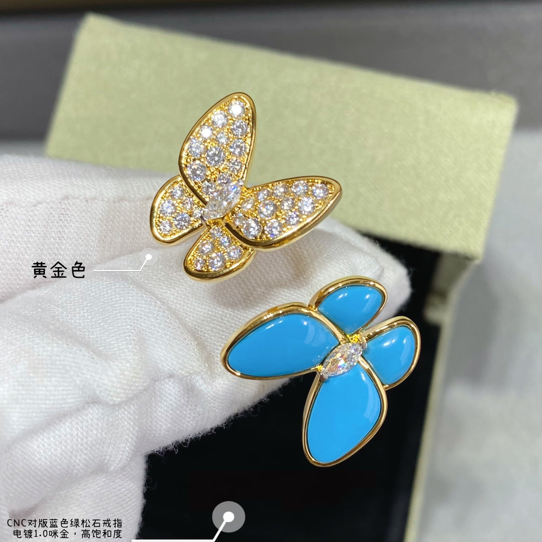 Blue-enamel butterfly stud earrings with gold-tone pavé stone details