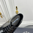 Prada unisex lace-up dress shoe, black leather with PRADA logo on insole.