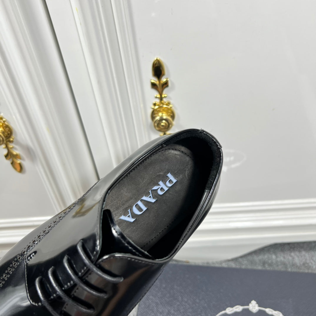 Prada unisex lace-up dress shoe, black leather with PRADA logo on insole.