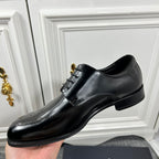 Prada unisex lace-up dress shoes, black leather with smooth side panel and low sole.
